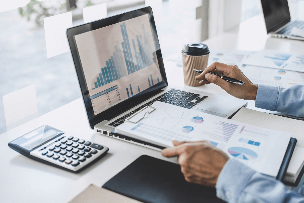 A CFO looking at financial charts on a laptop